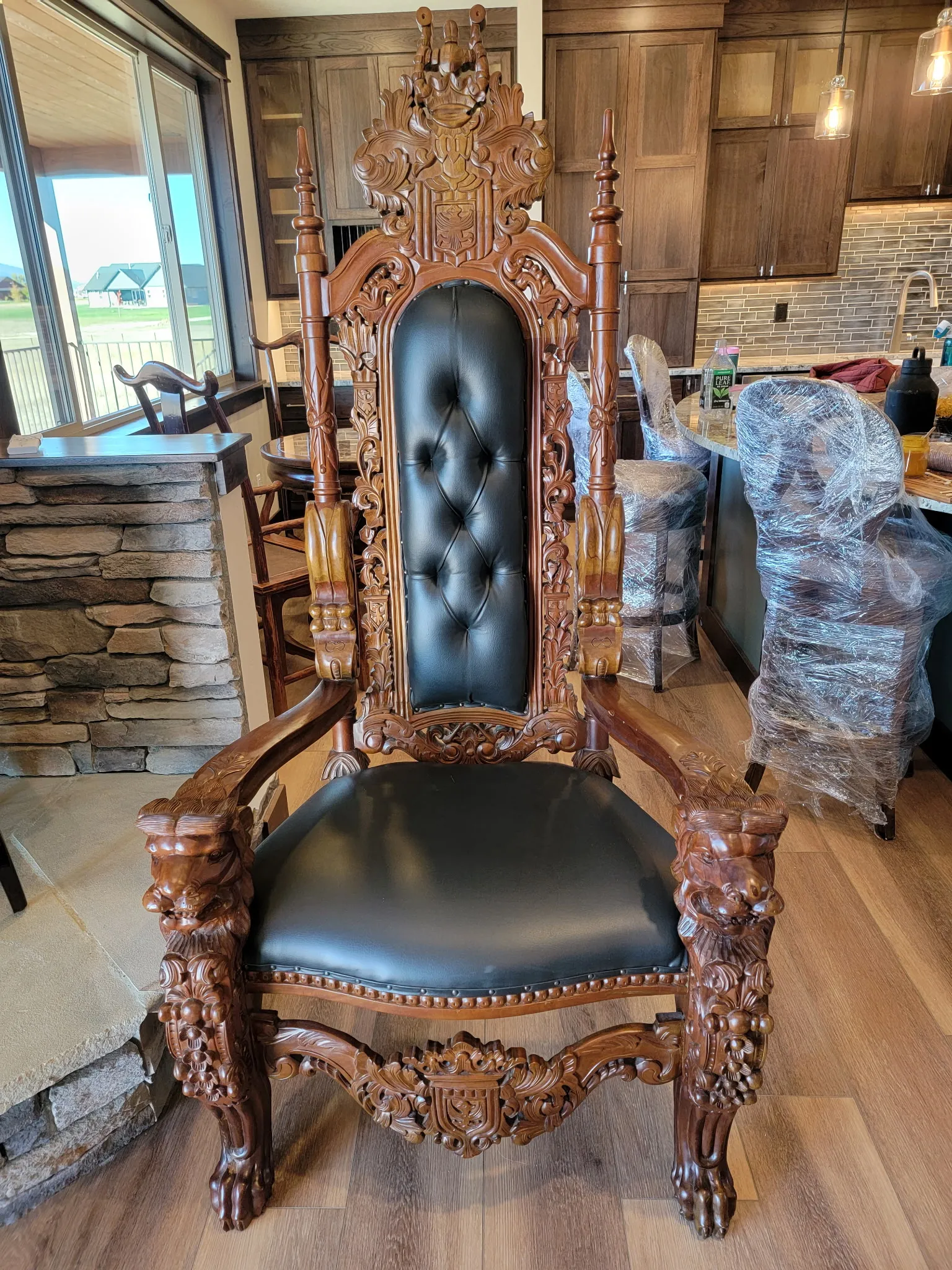 An ornate carved throne chair staged for a high-value move
